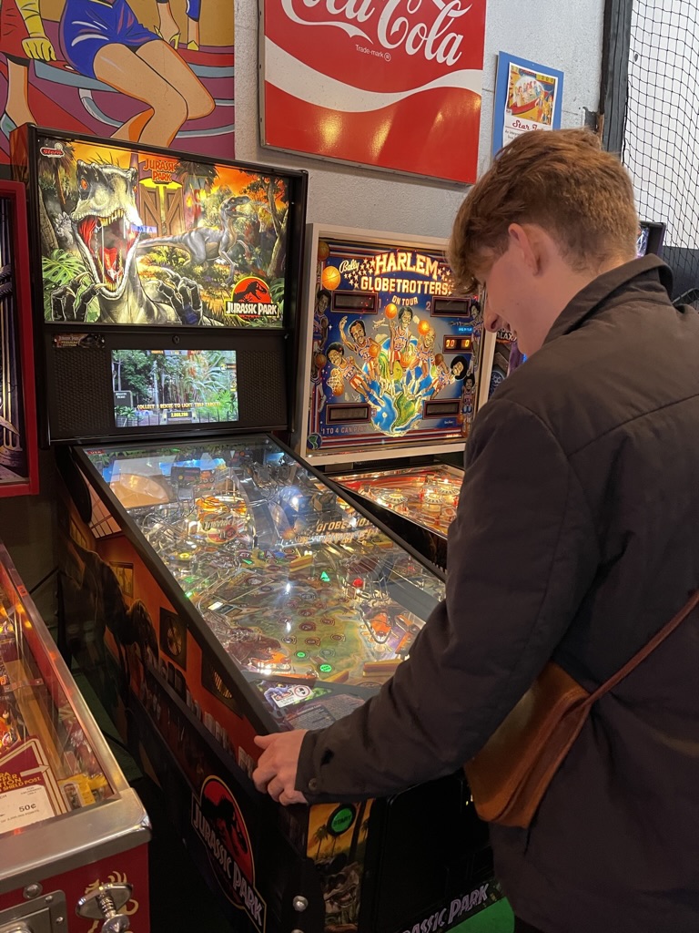 Enjoying a game of pinball at Free Gold Watch.