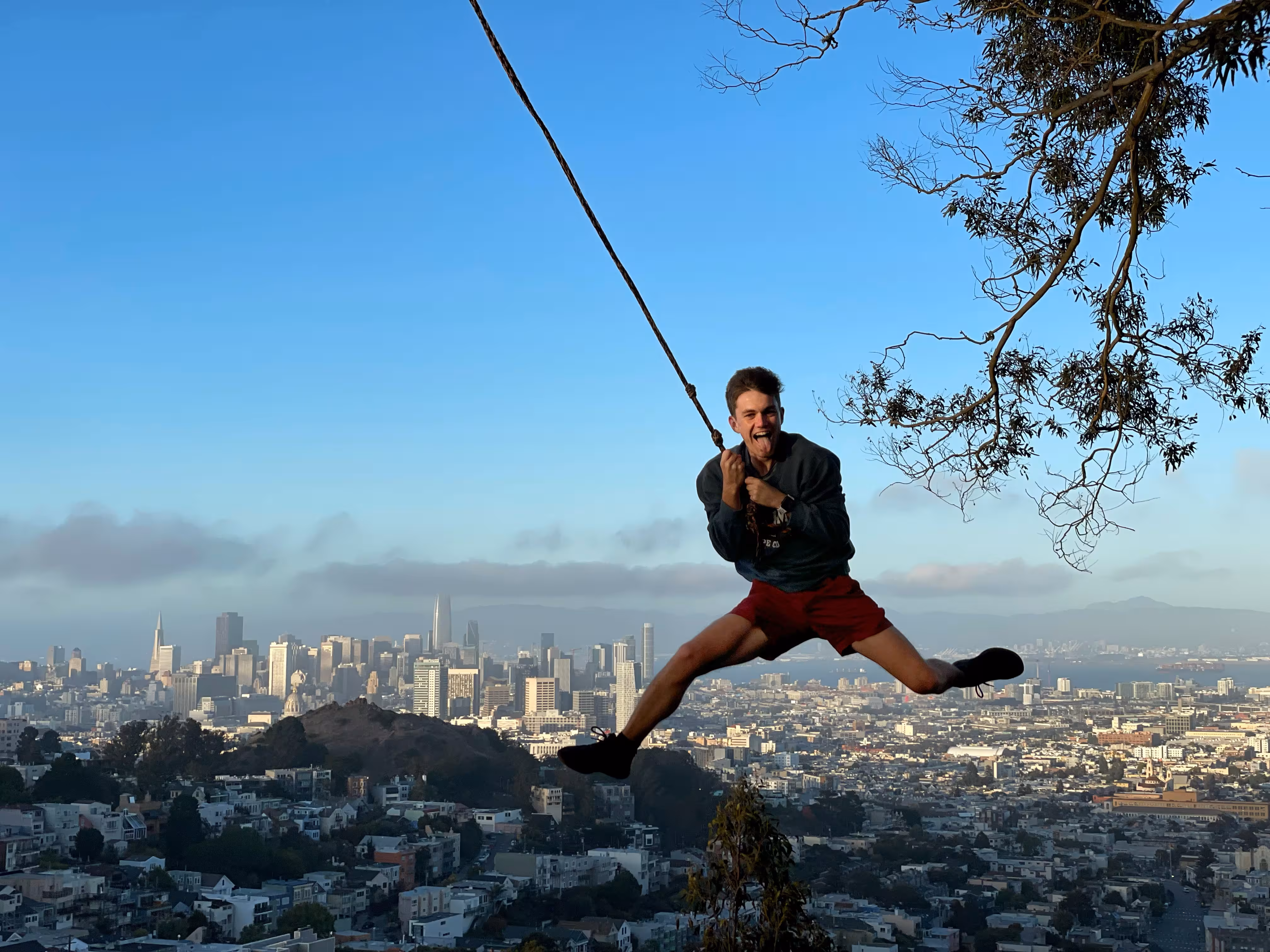 Soaring above the city on a rope swing at Tank Hill