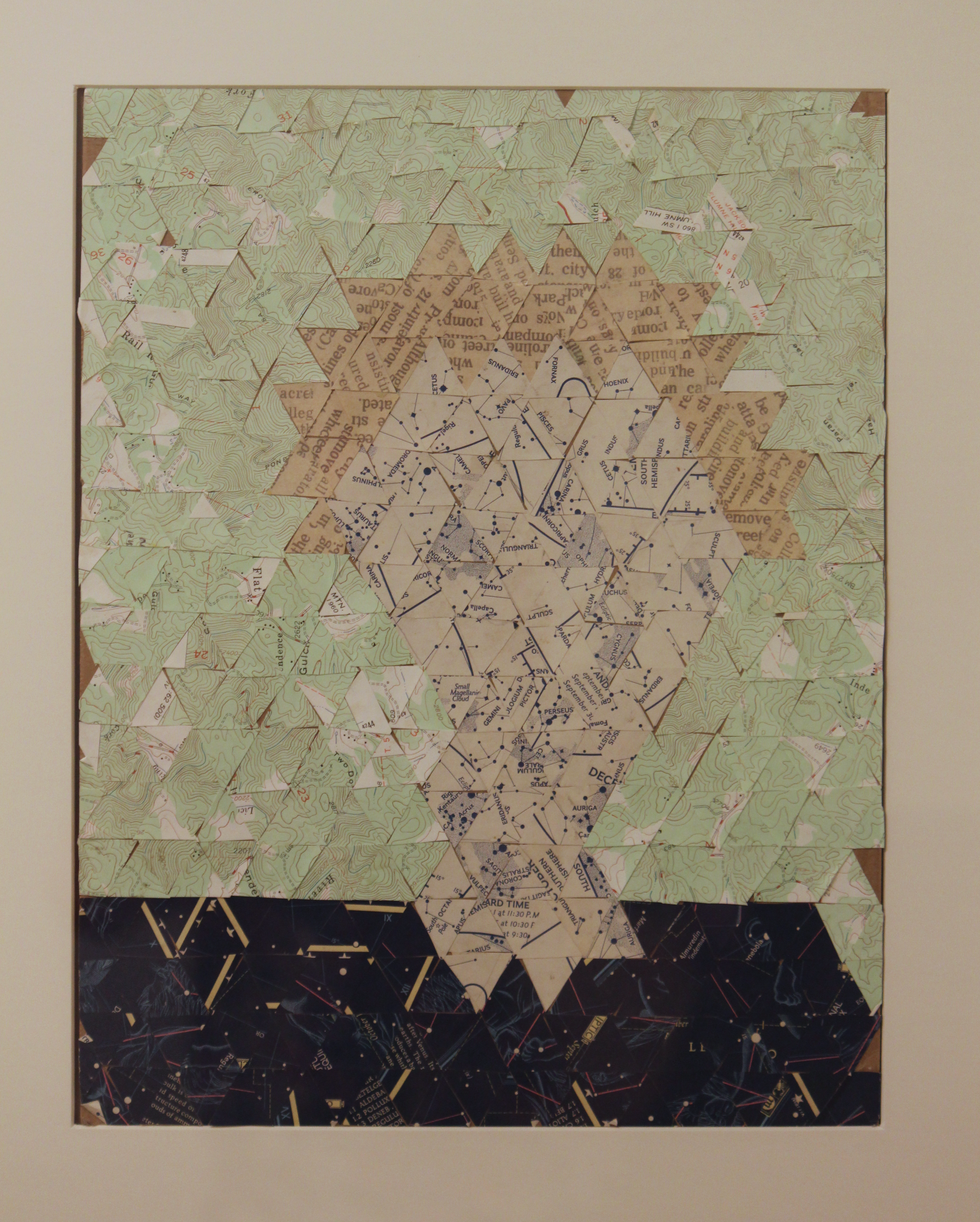 A physical collage of that selfie, recreated through a collage of paper triangles. 2020